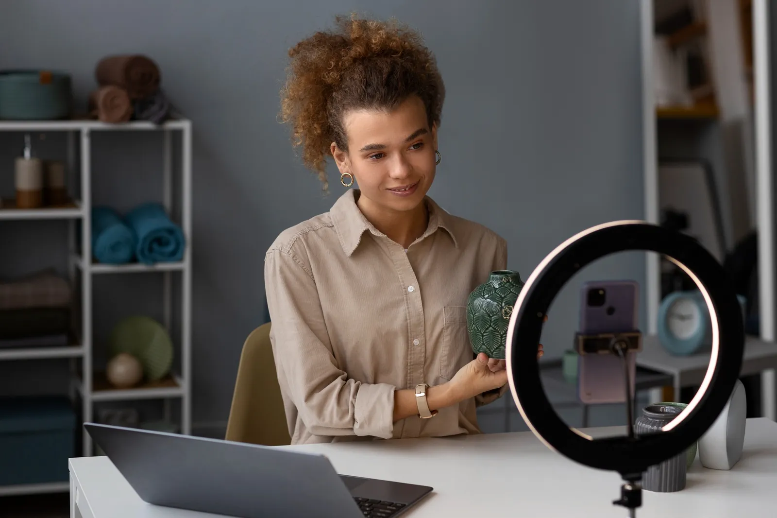 A creator streaming from her desk with a ring light