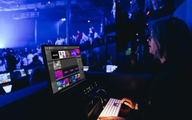 An operator mixing a concert from a laptop