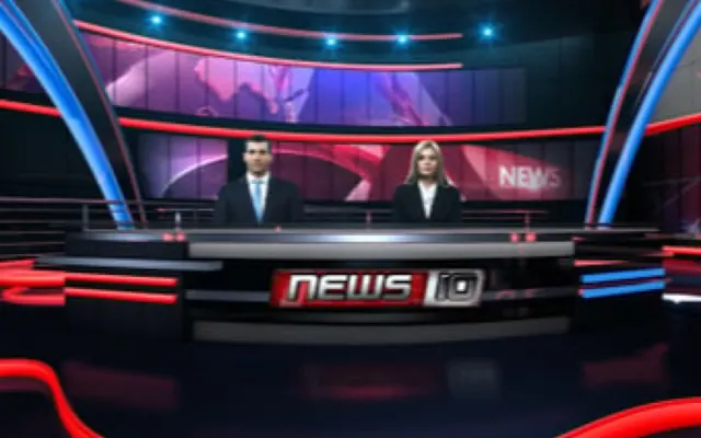 Two presenters at a news desk